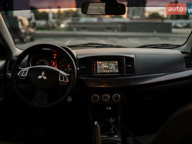 Чорний Міцубісі Lancer, об'ємом двигуна 2 л та пробігом 203 тис. км за 7000 $, фото 13 на Automoto.ua