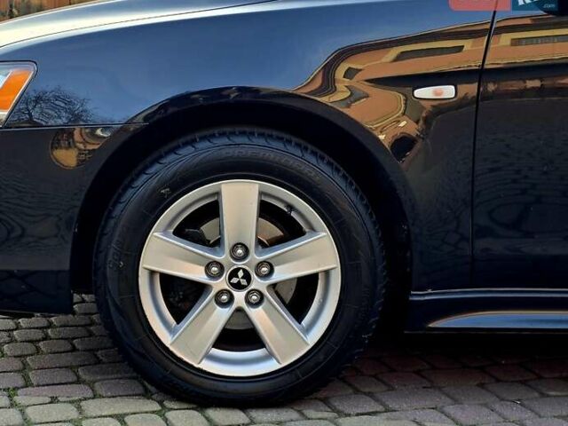 Чорний Міцубісі Lancer, об'ємом двигуна 2 л та пробігом 260 тис. км за 6555 $, фото 12 на Automoto.ua