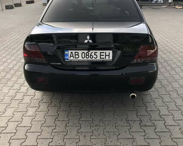 Чорний Міцубісі Lancer, об'ємом двигуна 1.59 л та пробігом 179 тис. км за 4980 $, фото 5 на Automoto.ua