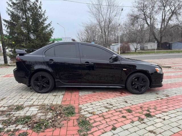 Черный Мицубиси Лансер, объемом двигателя 2 л и пробегом 217 тыс. км за 5500 $, фото 4 на Automoto.ua