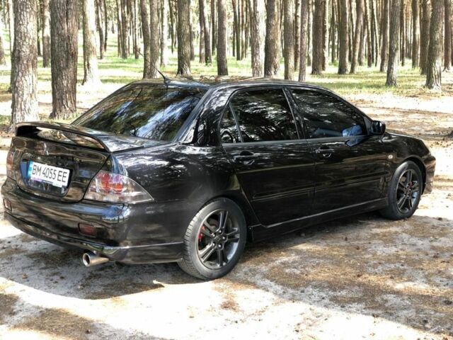 Чорний Міцубісі Lancer, об'ємом двигуна 2 л та пробігом 170 тис. км за 5650 $, фото 7 на Automoto.ua