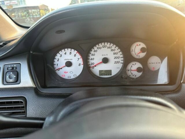 Черный Мицубиси Лансер, объемом двигателя 1.6 л и пробегом 305 тыс. км за 4799 $, фото 5 на Automoto.ua