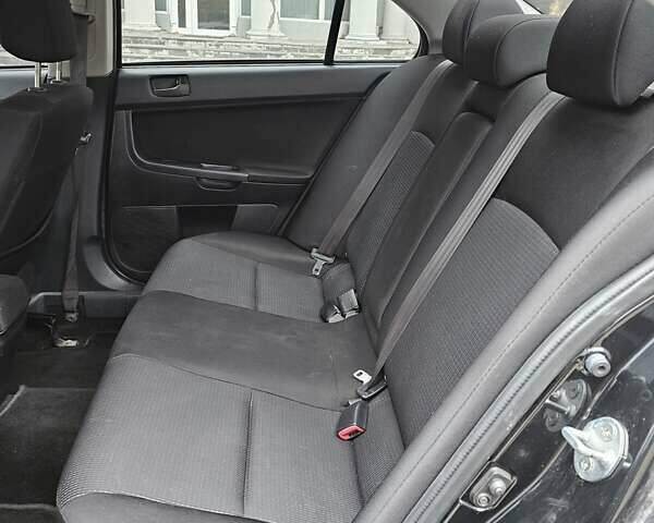 Міцубісі Lancer 2007 у Києві на Automoto.ua Чорний Міцубісі Lancer, об'ємом двигуна 2 л та пробігом 115 тис. км за 5000 $, фото 18 на Automoto.ua