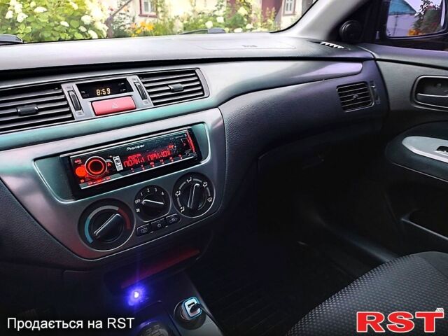 Чорний Міцубісі Lancer, об'ємом двигуна 1.6 л та пробігом 201 тис. км за 4000 $, фото 10 на Automoto.ua
