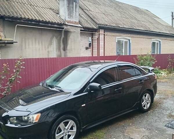 Чорний Міцубісі Lancer, об'ємом двигуна 2 л та пробігом 273 тис. км за 7100 $, фото 1 на Automoto.ua