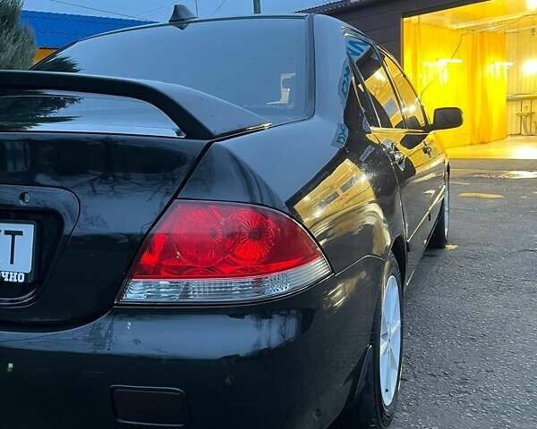 Черный Мицубиси Лансер, объемом двигателя 1.6 л и пробегом 249 тыс. км за 5000 $, фото 9 на Automoto.ua