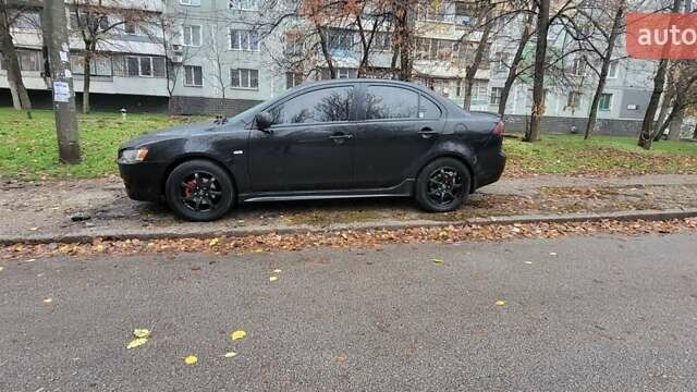 Черный Мицубиси Лансер, объемом двигателя 2 л и пробегом 260 тыс. км за 5500 $, фото 1 на Automoto.ua