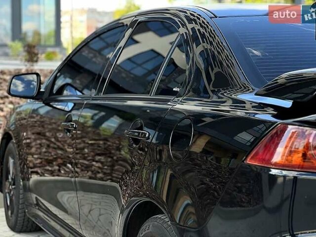 Черный Мицубиси Лансер, объемом двигателя 2 л и пробегом 205 тыс. км за 6500 $, фото 2 на Automoto.ua