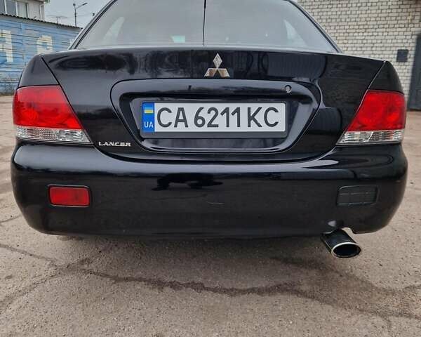 Чорний Міцубісі Lancer, об'ємом двигуна 1.6 л та пробігом 273 тис. км за 3999 $, фото 14 на Automoto.ua