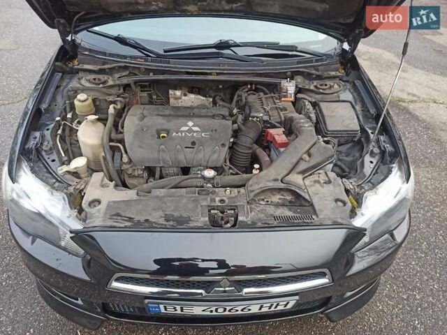 Черный Мицубиси Лансер, объемом двигателя 2 л и пробегом 195 тыс. км за 7899 $, фото 32 на Automoto.ua