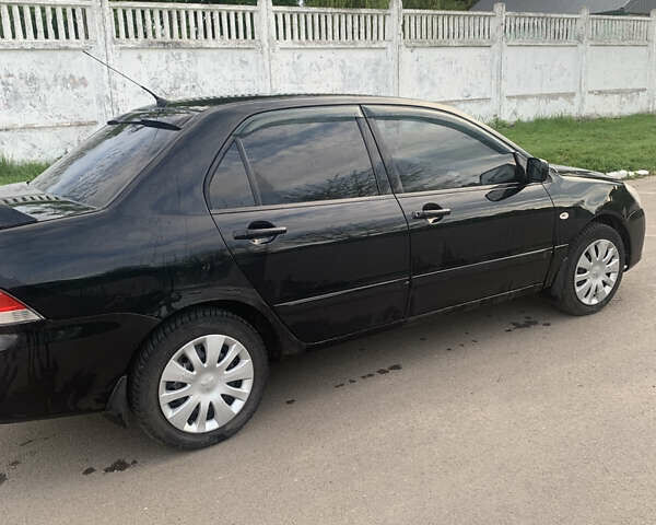 Черный Мицубиси Лансер, объемом двигателя 1.5 л и пробегом 248 тыс. км за 3200 $, фото 6 на Automoto.ua