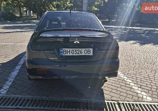 Чорний Міцубісі Lancer, об'ємом двигуна 2 л та пробігом 174 тис. км за 4800 $, фото 2 на Automoto.ua