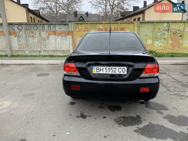 Черный Мицубиси Лансер, объемом двигателя 1.6 л и пробегом 164 тыс. км за 5200 $, фото 1 на Automoto.ua