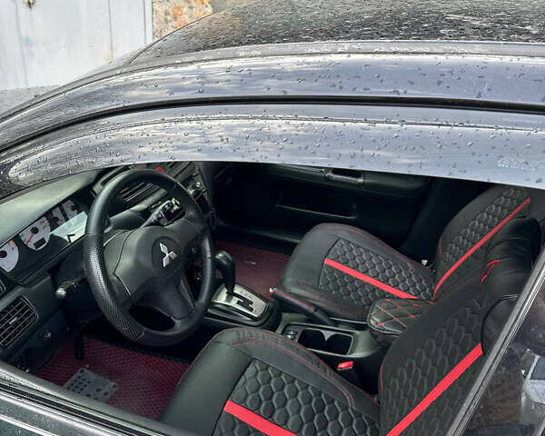 Черный Мицубиси Лансер, объемом двигателя 1.6 л и пробегом 211 тыс. км за 5700 $, фото 31 на Automoto.ua