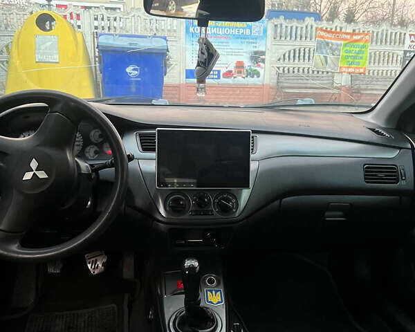 Черный Мицубиси Лансер, объемом двигателя 1.6 л и пробегом 180 тыс. км за 3499 $, фото 15 на Automoto.ua