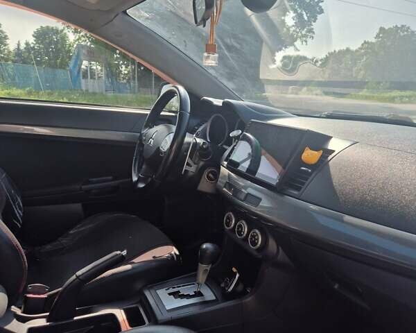 Чорний Міцубісі Lancer, об'ємом двигуна 2 л та пробігом 243 тис. км за 6600 $, фото 27 на Automoto.ua