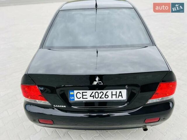 Чорний Міцубісі Lancer, об'ємом двигуна 1.6 л та пробігом 243 тис. км за 4950 $, фото 9 на Automoto.ua