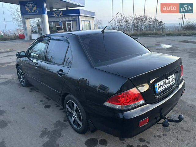 Черный Мицубиси Лансер, объемом двигателя 1.6 л и пробегом 315 тыс. км за 4000 $, фото 2 на Automoto.ua