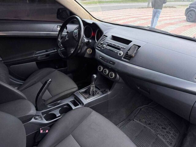 Черный Мицубиси Лансер, объемом двигателя 2 л и пробегом 217 тыс. км за 5500 $, фото 8 на Automoto.ua