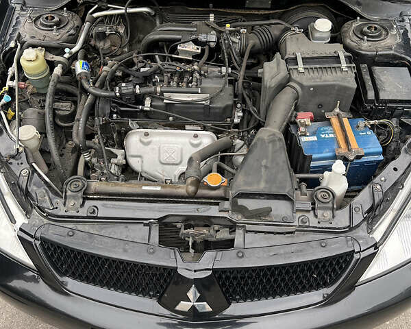 Чорний Міцубісі Lancer, об'ємом двигуна 1.58 л та пробігом 256 тис. км за 4200 $, фото 9 на Automoto.ua