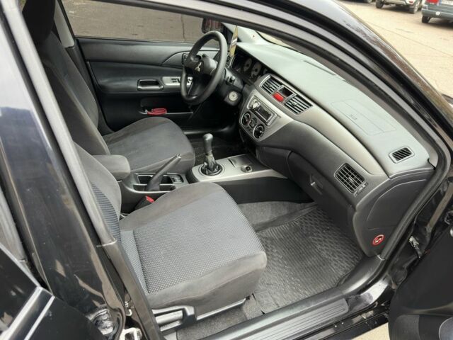 Черный Мицубиси Лансер, объемом двигателя 1.6 л и пробегом 173 тыс. км за 4700 $, фото 17 на Automoto.ua