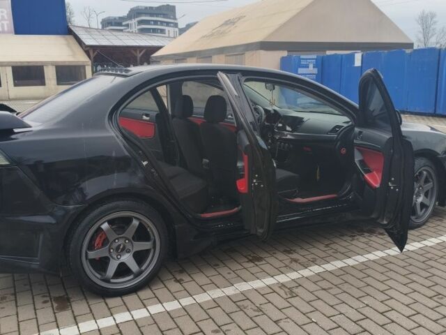 Черный Мицубиси Лансер, объемом двигателя 2 л и пробегом 160 тыс. км за 8000 $, фото 6 на Automoto.ua