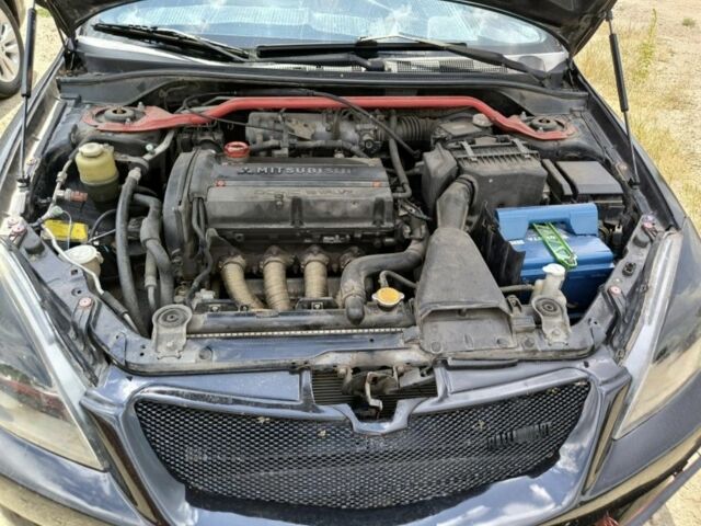 Черный Мицубиси Лансер, объемом двигателя 2 л и пробегом 161 тыс. км за 4500 $, фото 2 на Automoto.ua