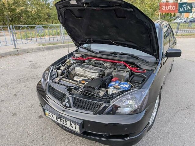 Чорний Міцубісі Lancer, об'ємом двигуна 2 л та пробігом 152 тис. км за 5500 $, фото 22 на Automoto.ua