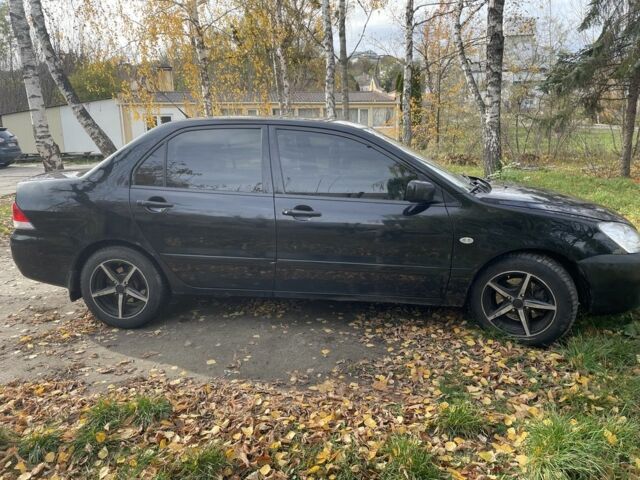 Міцубісі Lancer 2007 у Каневе на Automoto.ua Чорний Міцубісі Lancer, об'ємом двигуна 1.6 л та пробігом 310 тис. км за 4100 $, фото 6 на Automoto.ua