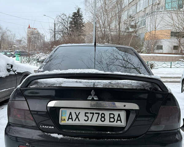 Черный Мицубиси Лансер, объемом двигателя 1.58 л и пробегом 265 тыс. км за 3550 $, фото 7 на Automoto.ua