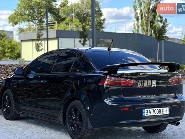 Черный Мицубиси Лансер, объемом двигателя 2 л и пробегом 205 тыс. км за 6500 $, фото 3 на Automoto.ua