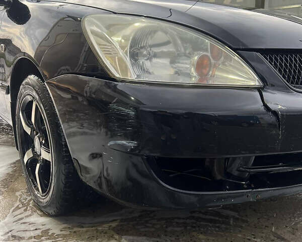 Черный Мицубиси Лансер, объемом двигателя 1.6 л и пробегом 180 тыс. км за 3499 $, фото 2 на Automoto.ua