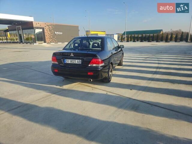 Чорний Міцубісі Lancer, об'ємом двигуна 1.59 л та пробігом 180 тис. км за 4999 $, фото 4 на Automoto.ua