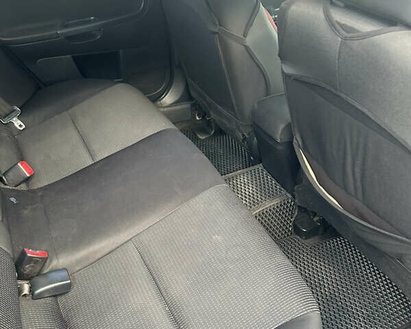 Черный Мицубиси Лансер, объемом двигателя 2 л и пробегом 208 тыс. км за 6500 $, фото 11 на Automoto.ua