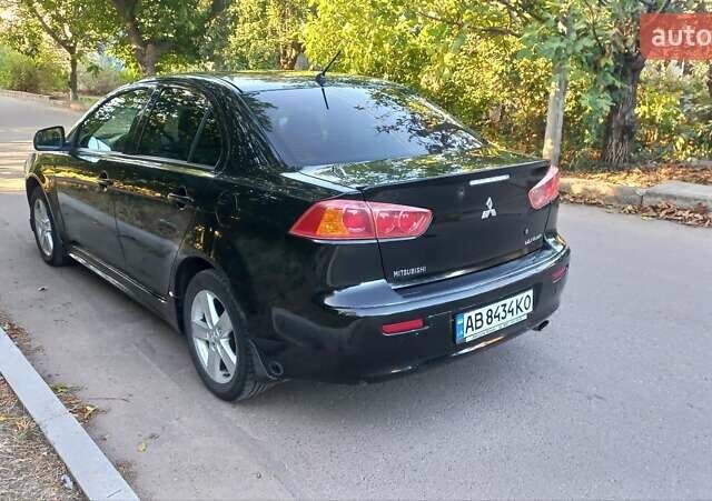 Черный Мицубиси Лансер, объемом двигателя 2 л и пробегом 290 тыс. км за 5800 $, фото 2 на Automoto.ua
