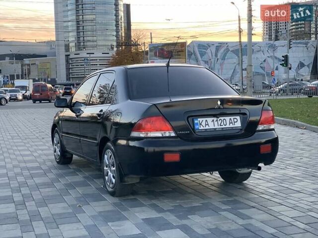 Чорний Міцубісі Lancer, об'ємом двигуна 1.58 л та пробігом 237 тис. км за 4300 $, фото 2 на Automoto.ua