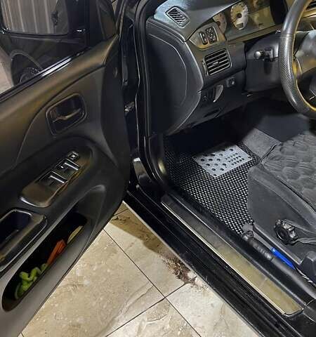 Черный Мицубиси Лансер, объемом двигателя 1.6 л и пробегом 249 тыс. км за 5000 $, фото 13 на Automoto.ua