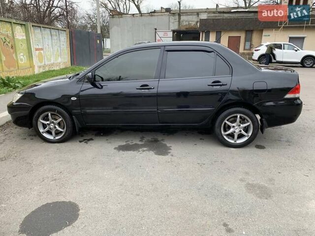 Черный Мицубиси Лансер, объемом двигателя 1.6 л и пробегом 164 тыс. км за 5200 $, фото 3 на Automoto.ua