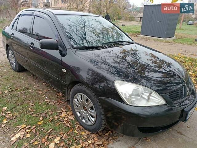 Чорний Міцубісі Lancer, об'ємом двигуна 1.58 л та пробігом 227 тис. км за 4100 $, фото 1 на Automoto.ua
