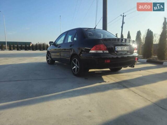 Чорний Міцубісі Lancer, об'ємом двигуна 1.59 л та пробігом 180 тис. км за 4999 $, фото 3 на Automoto.ua