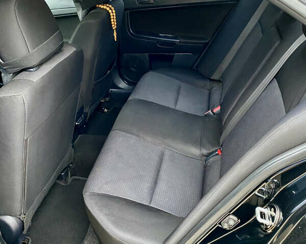 Черный Мицубиси Лансер, объемом двигателя 2 л и пробегом 164 тыс. км за 8300 $, фото 22 на Automoto.ua