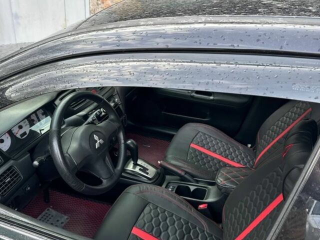 Черный Мицубиси Лансер, объемом двигателя 1.6 л и пробегом 211 тыс. км за 5600 $, фото 5 на Automoto.ua