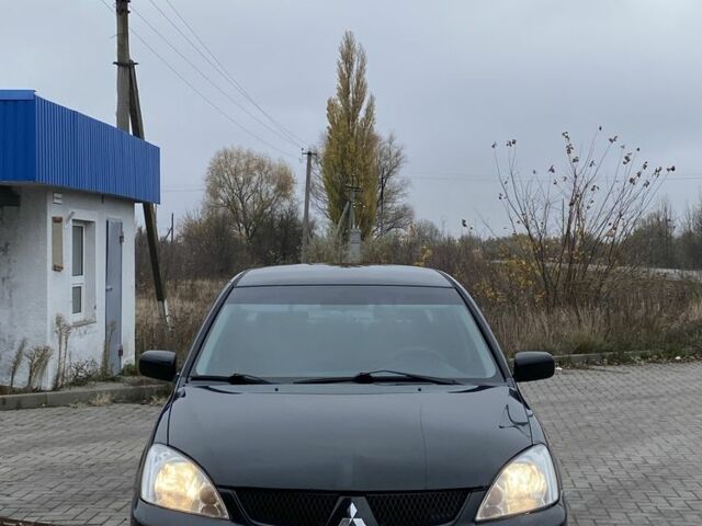 Черный Мицубиси Лансер, объемом двигателя 1.6 л и пробегом 263 тыс. км за 2900 $, фото 2 на Automoto.ua