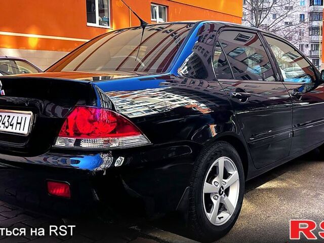 Чорний Міцубісі Lancer, об'ємом двигуна 1.6 л та пробігом 189 тис. км за 5500 $, фото 3 на Automoto.ua