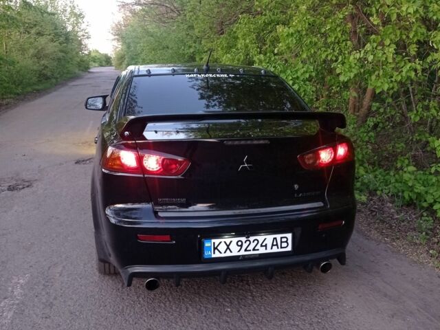 Черный Мицубиси Лансер, объемом двигателя 2 л и пробегом 245 тыс. км за 7500 $, фото 1 на Automoto.ua