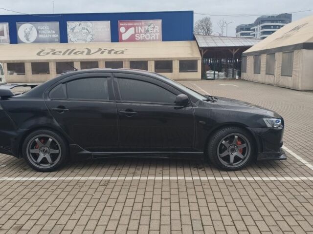 Черный Мицубиси Лансер, объемом двигателя 2 л и пробегом 160 тыс. км за 8000 $, фото 3 на Automoto.ua