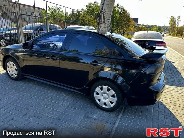 Черный Мицубиси Лансер, объемом двигателя 2 л и пробегом 250 тыс. км за 5900 $, фото 3 на Automoto.ua