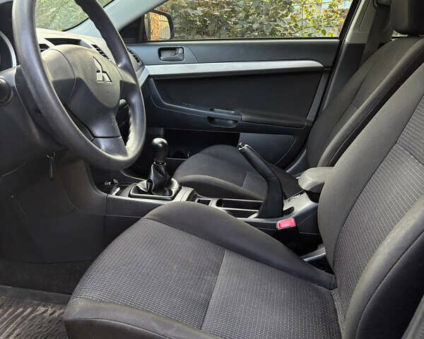 Черный Мицубиси Лансер, объемом двигателя 1.5 л и пробегом 111 тыс. км за 7500 $, фото 13 на Automoto.ua