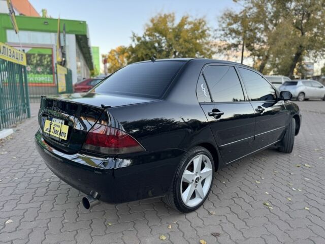 Черный Мицубиси Лансер, объемом двигателя 1.6 л и пробегом 320 тыс. км за 3500 $, фото 6 на Automoto.ua