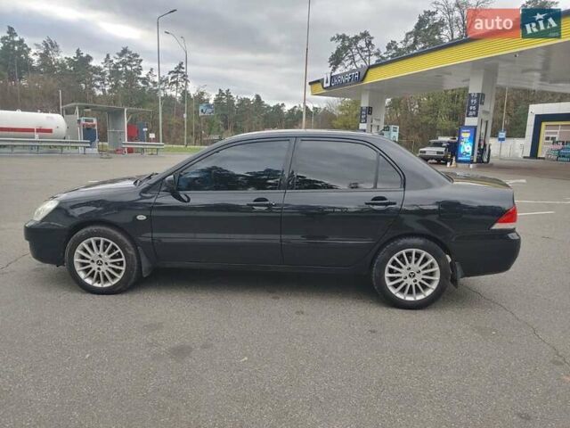 Чорний Міцубісі Lancer, об'ємом двигуна 1.58 л та пробігом 190 тис. км за 3750 $, фото 3 на Automoto.ua